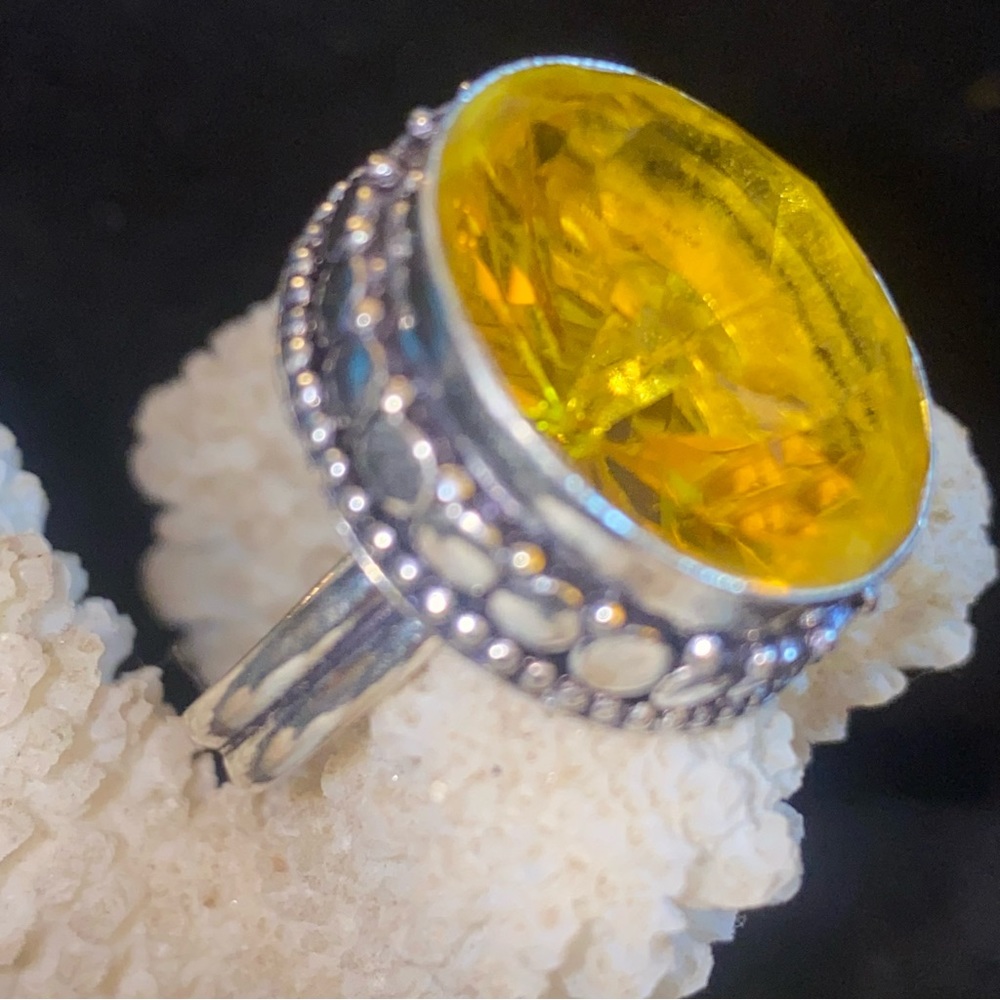 Sparkly Lemon Citrine facet cut stone set in a 925 ss ring setting